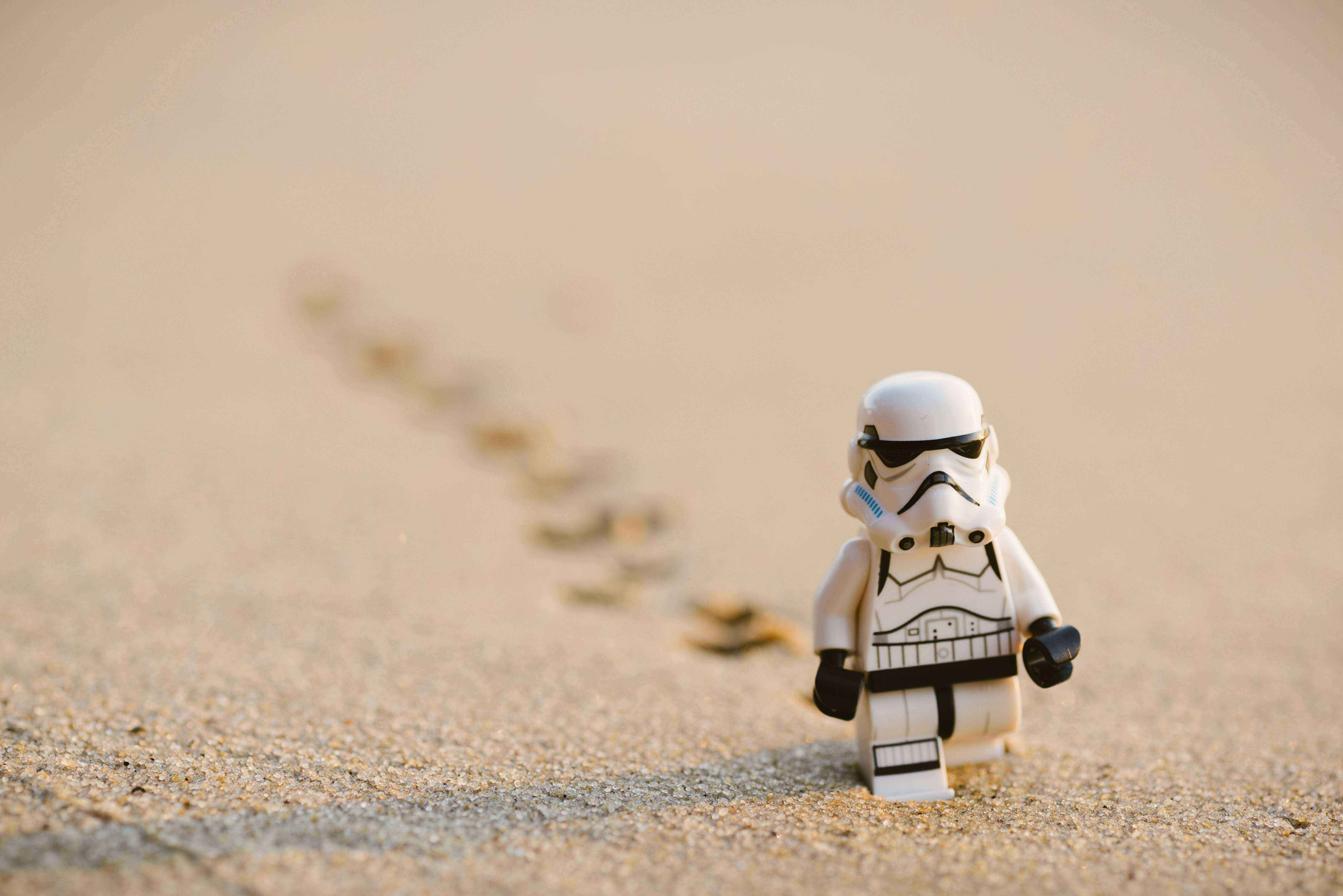 Toy Stormtrooper leaving footprints in the sand